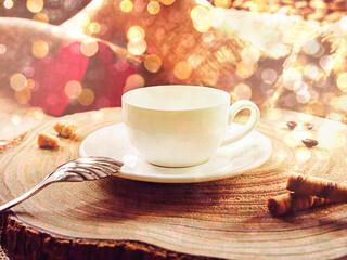 White cup with coffee, on a wooden background in the morning sun. Two red hearts in the background. bokeh selective focus.
