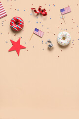 Composition with donuts, USA flags and confetti on beige background. Independence Day celebration