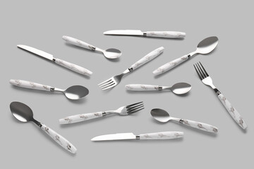 Stylish cutlery on grey background