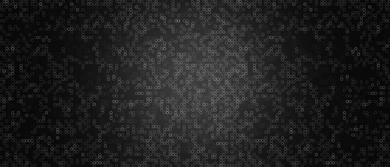 Abstract dark background of small rings in shades of black and gray colors