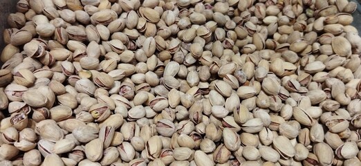  Lot of delicious pistachios are in the box