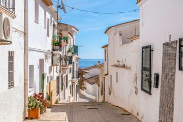 Altea old town with narrow streets and whitewashed houses. Architecture in small picturesque village of Altea near Mediterranean sea in Alicante province, Valencian Community, Spain