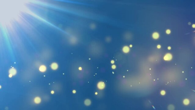 Lens flare and floating gold embers and particles on royal blue. Versatile abstract background/ transition/ overlay.