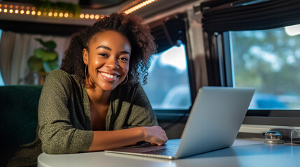 Happy African American Young Adult Female Enjoying Working Remotely Inside Her RV Camper Trailer - Generative AI.