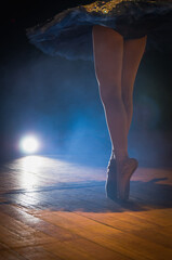 Closeup of Ballerina Legs in Dark Theater on Fingertips. Beautif - 603801657