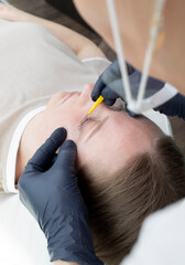 Beautician, Beauty Master Combing Eyelashes Of Caucasian Beautiful Client After Lamination...