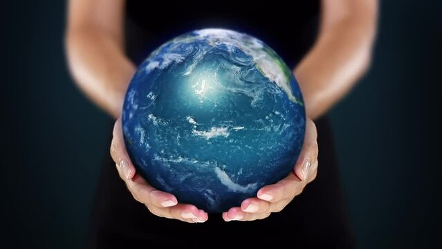 Female Hands Holding Hyper Realistic Planet Earth. Environmental Conservation, Save the Planet, Ecology, Sustainable Lifestyle. World Earth Day. Loopable from frame 49 to frame 497.