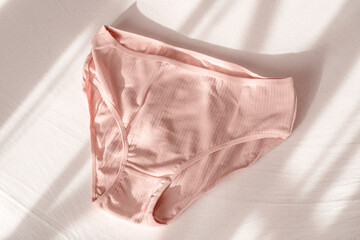 Women's briefs cotton. lady's underwear, textiles panties for women. Healthy, safe, modern comfortable clothes for girls with natural solar lighting