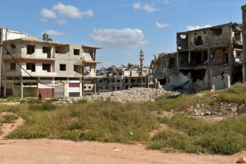 Fototapeta na wymiar Destroyed houses as a result of the Syrian civil war in Homs city. Syria.