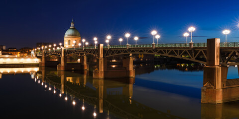 French city Toulouse and Garonne river night view. France, Europe