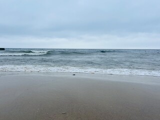 Cloudy gray seascape, sea coast, windy cloudy weather 