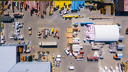 Aerial view of building materials warehouse. Large storage of construction materials in industrial...