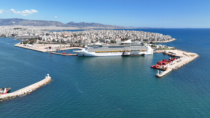 Aerial drone photo of crowded cruise liner ship with pool facilities anchored in Port of Piraeus, Attica, Greece