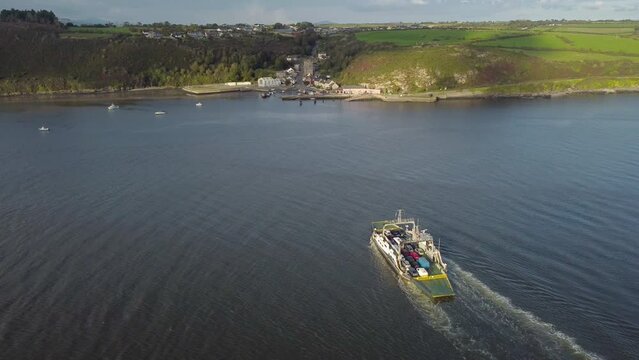 Drone River Suir, Ireland - Aerial view of The Passage East Ferry across River Suir linking the villages of Passage East in Co. Waterford and Ballyhack in Co. Wexford