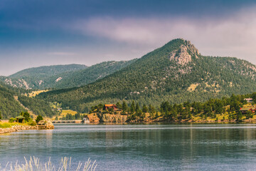 Estes Lake near Estes Park, Colorado, in summer; mountain ridge of Rocky Mountains in background