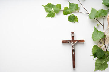Christian Pentecost. Whit Sunday. A cross with a birch branch on a white, green, red and black...