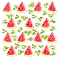 Juicy watermelon slices and mint leaves arranged in a pattern isolated on white background, top view