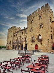 Revillagigedo Palace and a terraze of a sidreria, Gijon, Asturias, Spain.