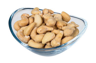 Roasted salted cashew nuts in glass bowl isolated on white background. Anacardium occidentale. Closeup an oval transparent dish full of yummy salty flavored cashews. Culinary nosh of edible bio seeds.