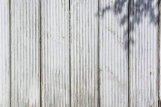 wall of old painted boards as a background, painted wood as a background in the spring sun 16