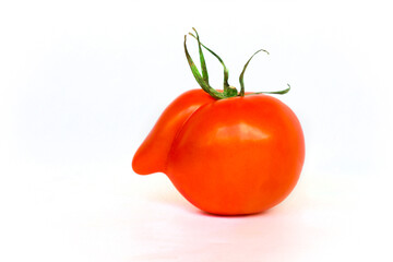 Deformed red tomatoes on a white background ,Funny deformed red tomato with a nose 