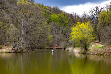Fototapeta na wymiar ..Colorful leaves on trees along lake