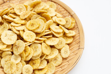 Banana slice chips on white background.