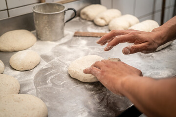 hands kneading dough