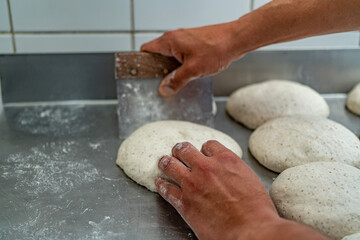 hands kneading dough