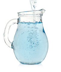 Water is pouring into a pitcher