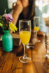 drinking mimosas at weekend brunch