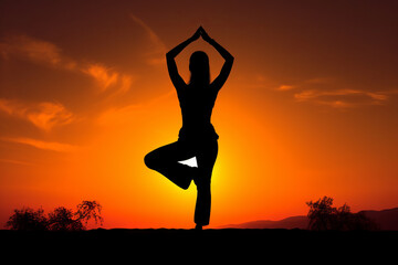 Fototapeta na wymiar yoga against a sunset