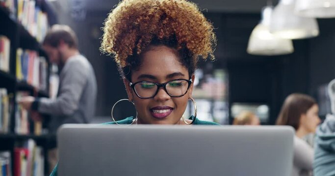 Laptop, woman and student smile in library, learning or research online in university. Computer, college and happy African female person web browsing for knowledge, education or studying on internet.