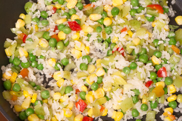 Hawaiian mixture in a frying pan . View from above. Closeup