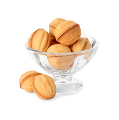 Glass dessert bowl and delicious nut shaped cookies on white background