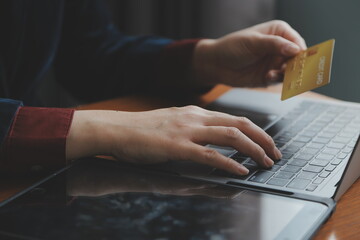 Women holding credit card and using smartphones at home.Online shopping, internet banking, store...