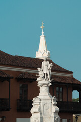 Fototapeta na wymiar Cartagena, Bolivar, Colombia. March 14, 2023: Colon sculpture with blue sky.