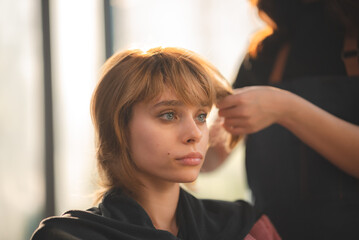 Fototapeta premium client woman clean washing a hair in salon, professional hairdresser washing haircut customer hair with water and shampoo treatment, coiffure beauty head hair care, fashion service