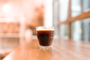 Professional hipster barista making drip brewing, filtered coffee or pour over coffee with hot water and filter paper in coffee shop cafe, black vintage tone of fresh caffeine aroma beverage