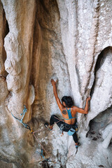 Rock-Climbing Experienced Female Climbing Mountain in Krabi, Thailand