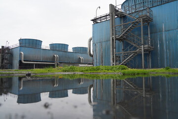 Obraz premium Almaty, Kazakhstan - 04.17.2023 : Cooling towers with water at the old heating plant.