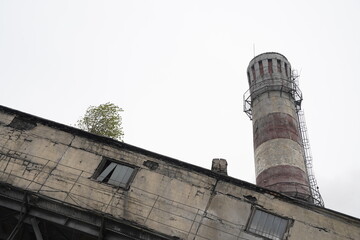 Almaty, Kazakhstan - 04.17.2023 : Pipes and technical compartments at the old heating plant.