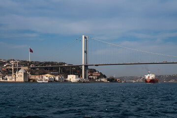 Fototapeta premium Ortakoy Mosque in Besiktas district on the embankment of Ortakoy Pier Square and the July 15 Martyrs Bridge (Bosphorus Bridge) from the Bosphorus, Istanbul, Turkey