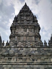Naklejka premium Yogyakarta, Indonesia – January 27, 2019: Shrine Of Prambanan Hindu Temple Compound Included In World Heritage List. Monumental Ancient Architecture, Carved Stone Walls. Selected Focus