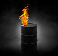 Black oil barrel with flames, on black background with smoke