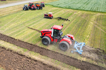large agricultural machine cultivates the land. The view from the top. Plowing land for planting...
