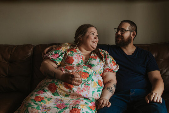 couple sitting and smiling at each other