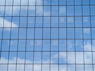 Fototapeta premium Cloud Reflections On A Windows Pattern