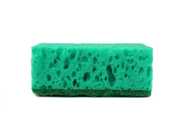 A green soft sponge for washing dishes lies on a white background.