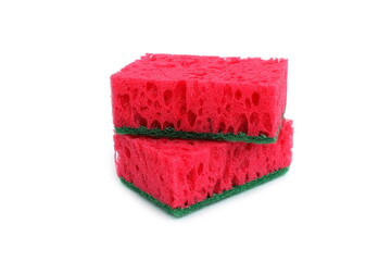 Two red sponges for washing dishes lie on a white background.